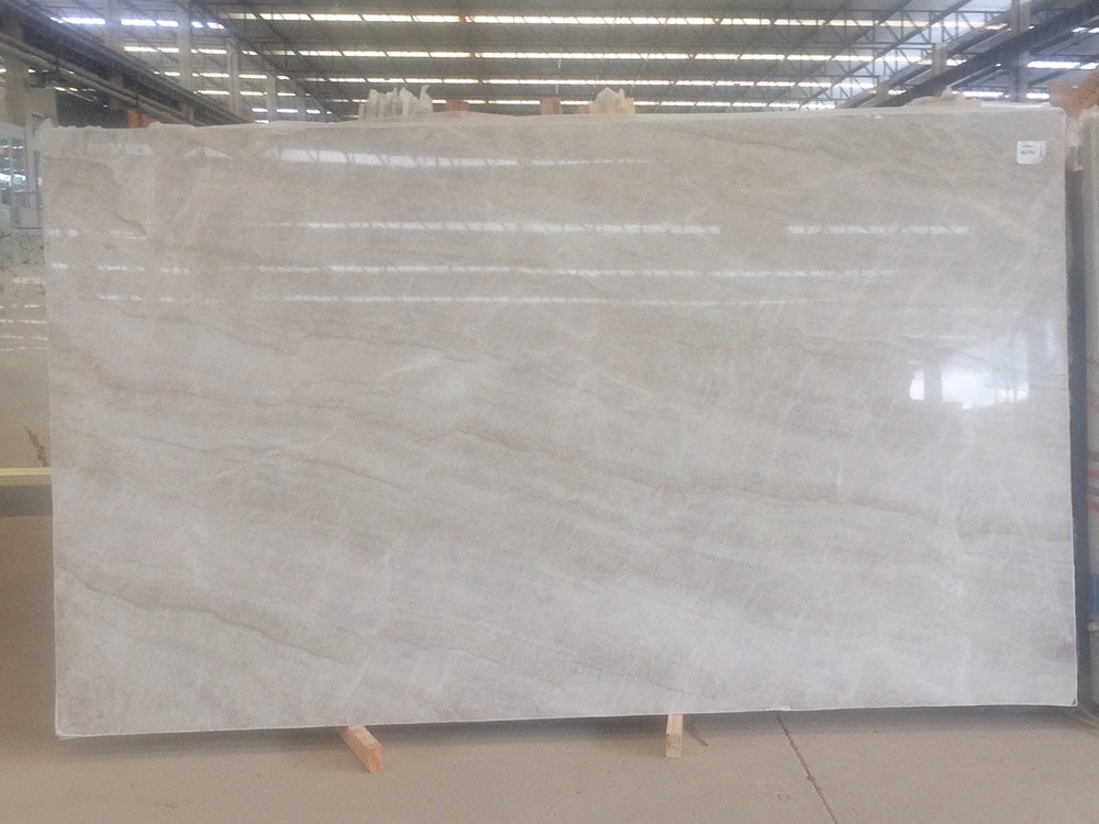 Matira — warm neutral tones; pattern and intensity vary batch to batch.